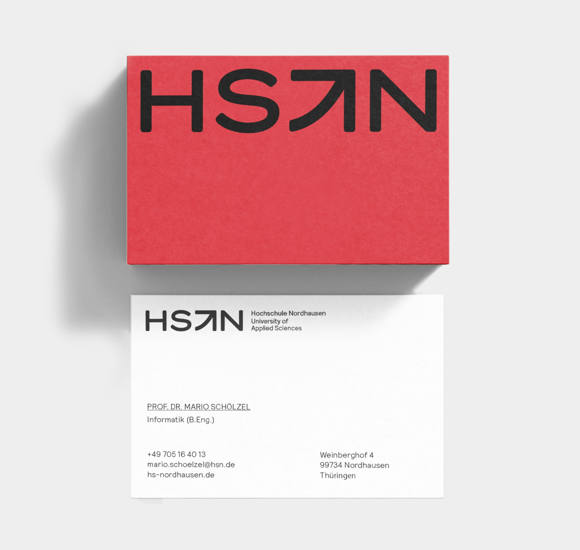 Mock-up showing business card with HSN branding applied