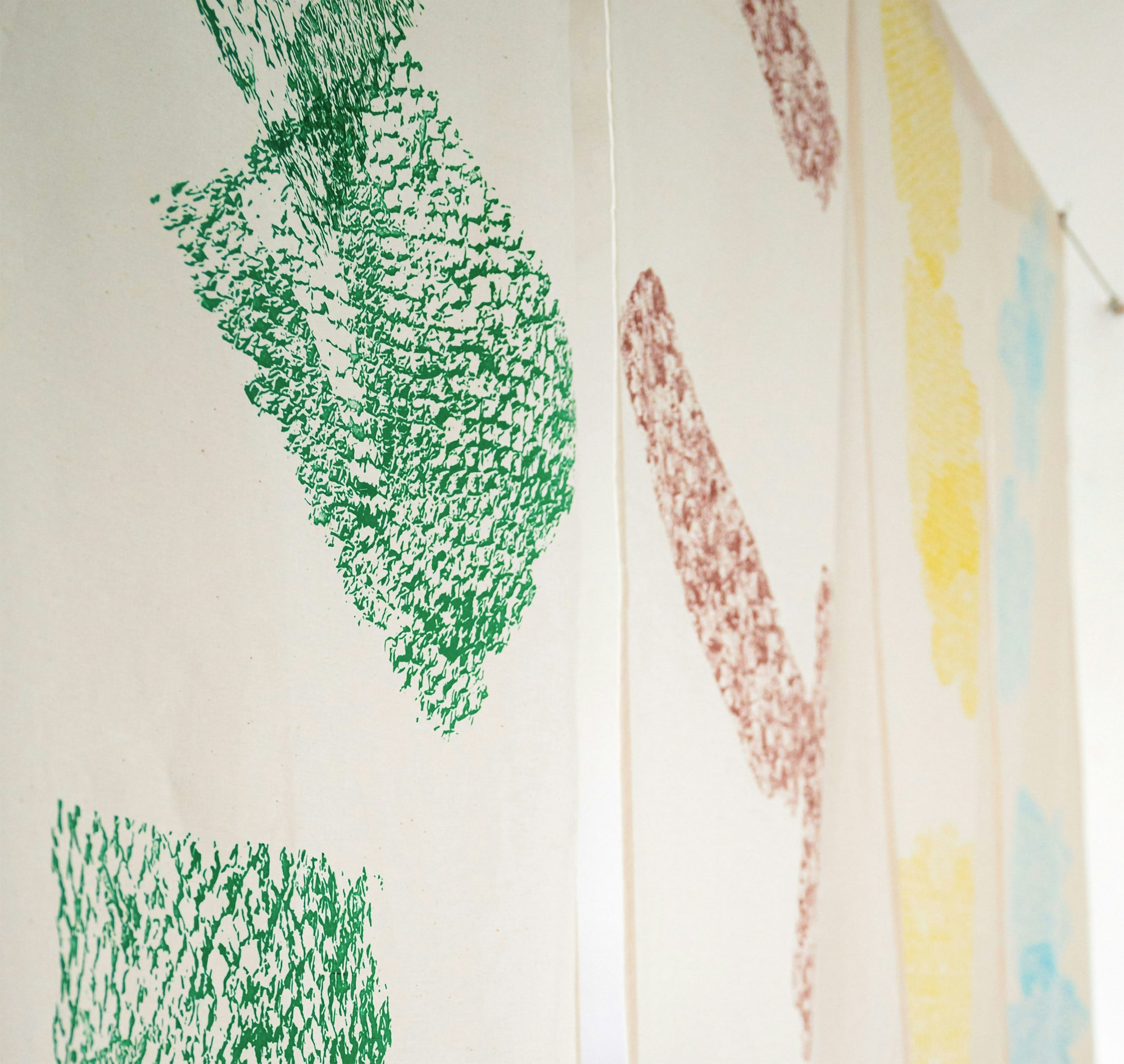 Photography of screen printed cotton textile with showing textures.