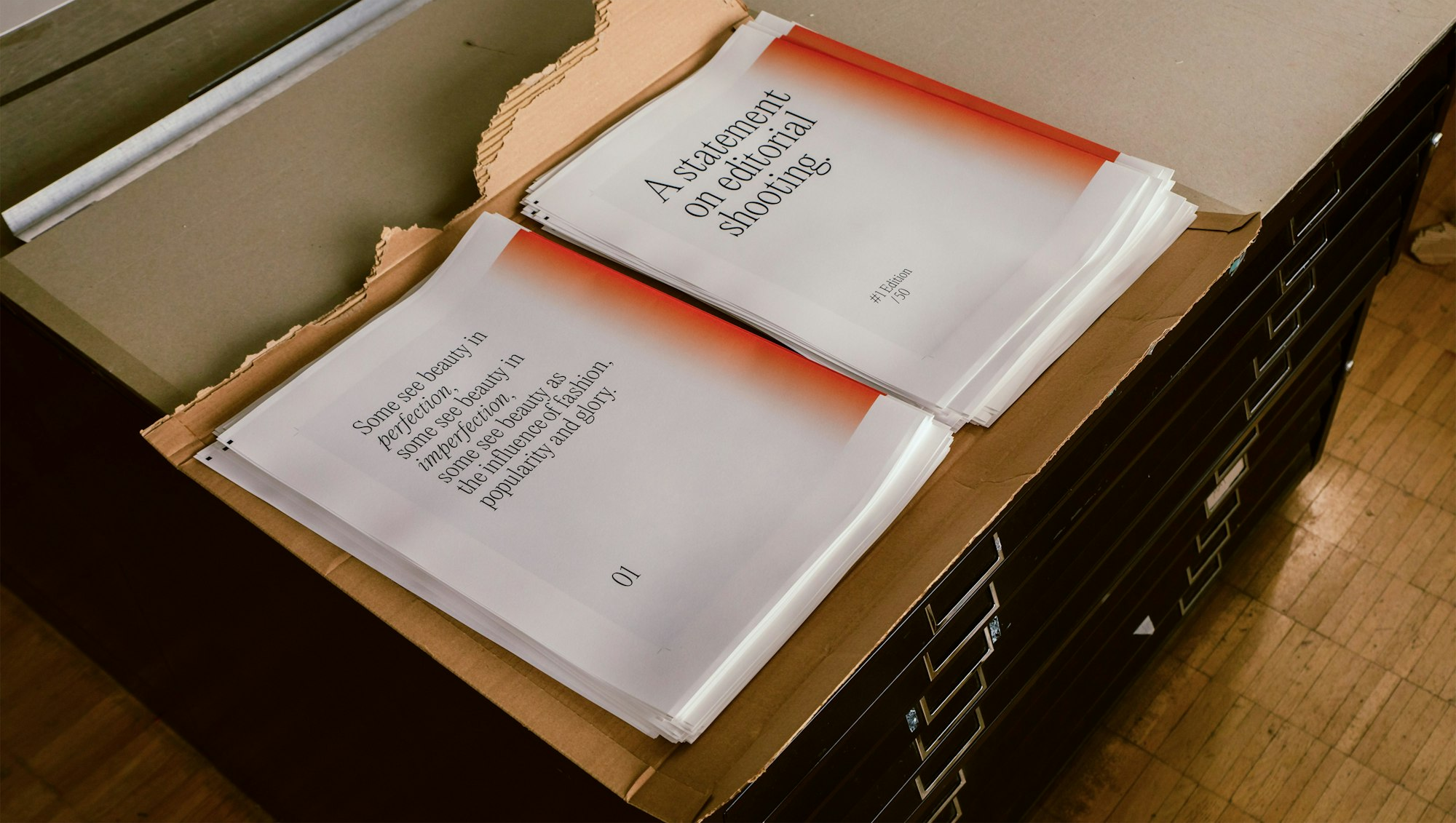 Photography of production process showing printed sheets.